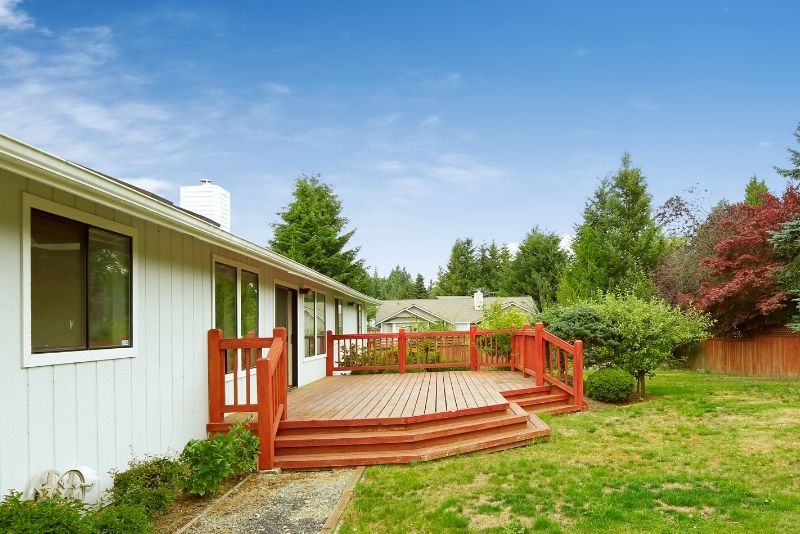 a picture of a a residential backyard with a decking area