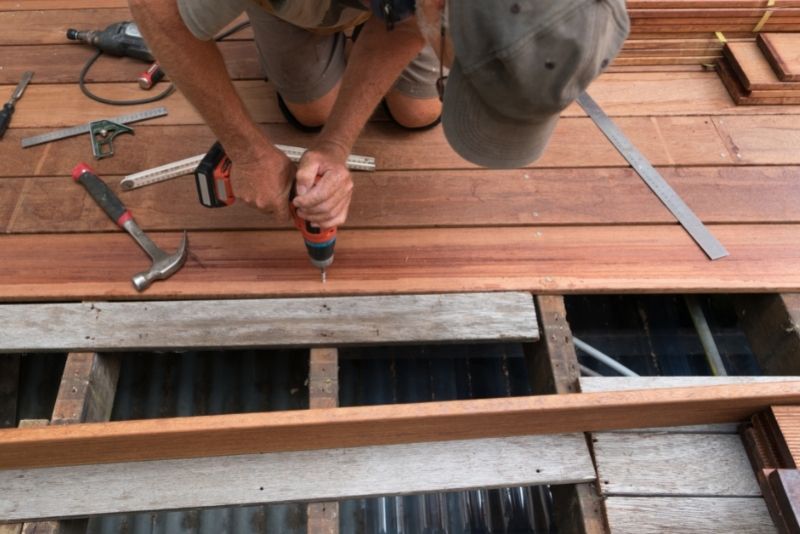 Builders installing a timber deck